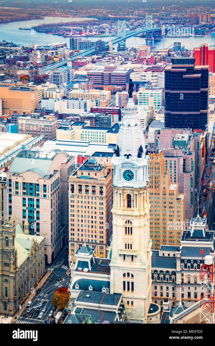 Aerial Philadelphia cityscape with the City Hall tower in the foreground and Ben Franklin bridge spanning Delaware river in the back Stock Photo
