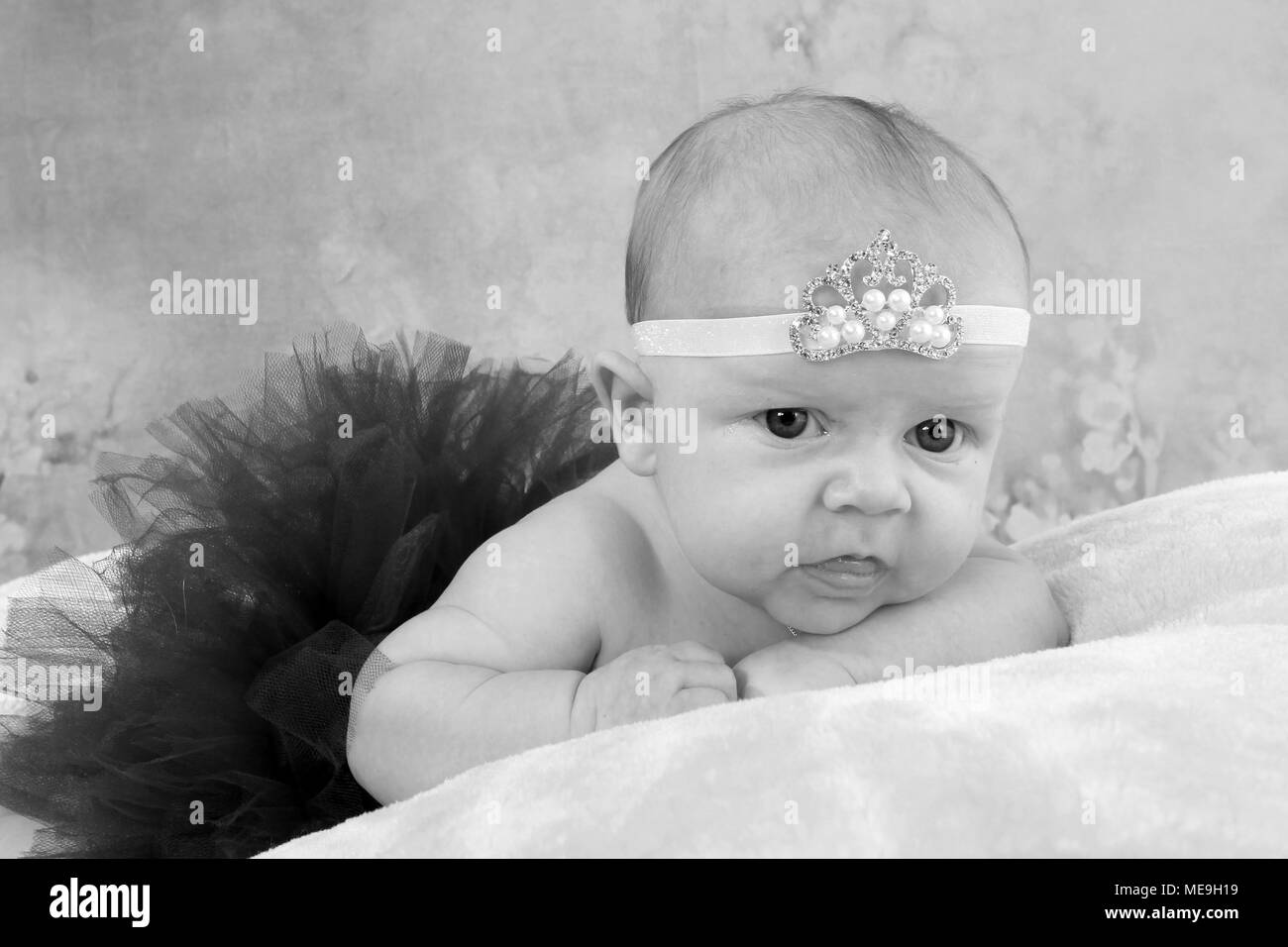 3 month old baby girl exploring in the nursery, cognitive development