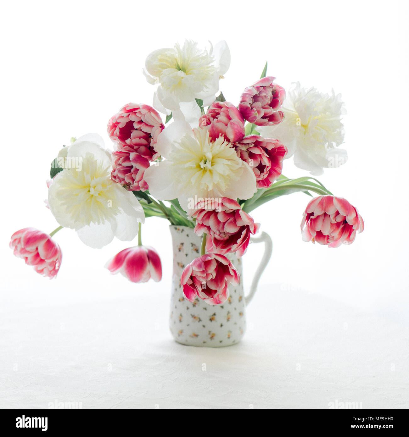 Tulips and Peonies in a pitcher Stock Photo