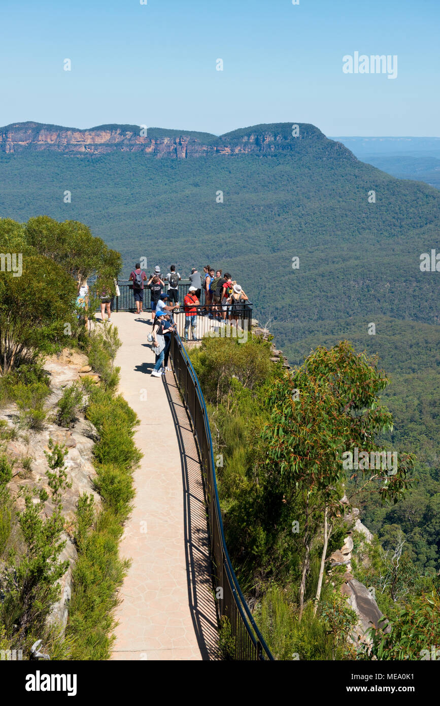 Tourists on a viewpoint of the Megalong Valley of the Blue Mountains at Katoomba. New South Wales Stock Photo