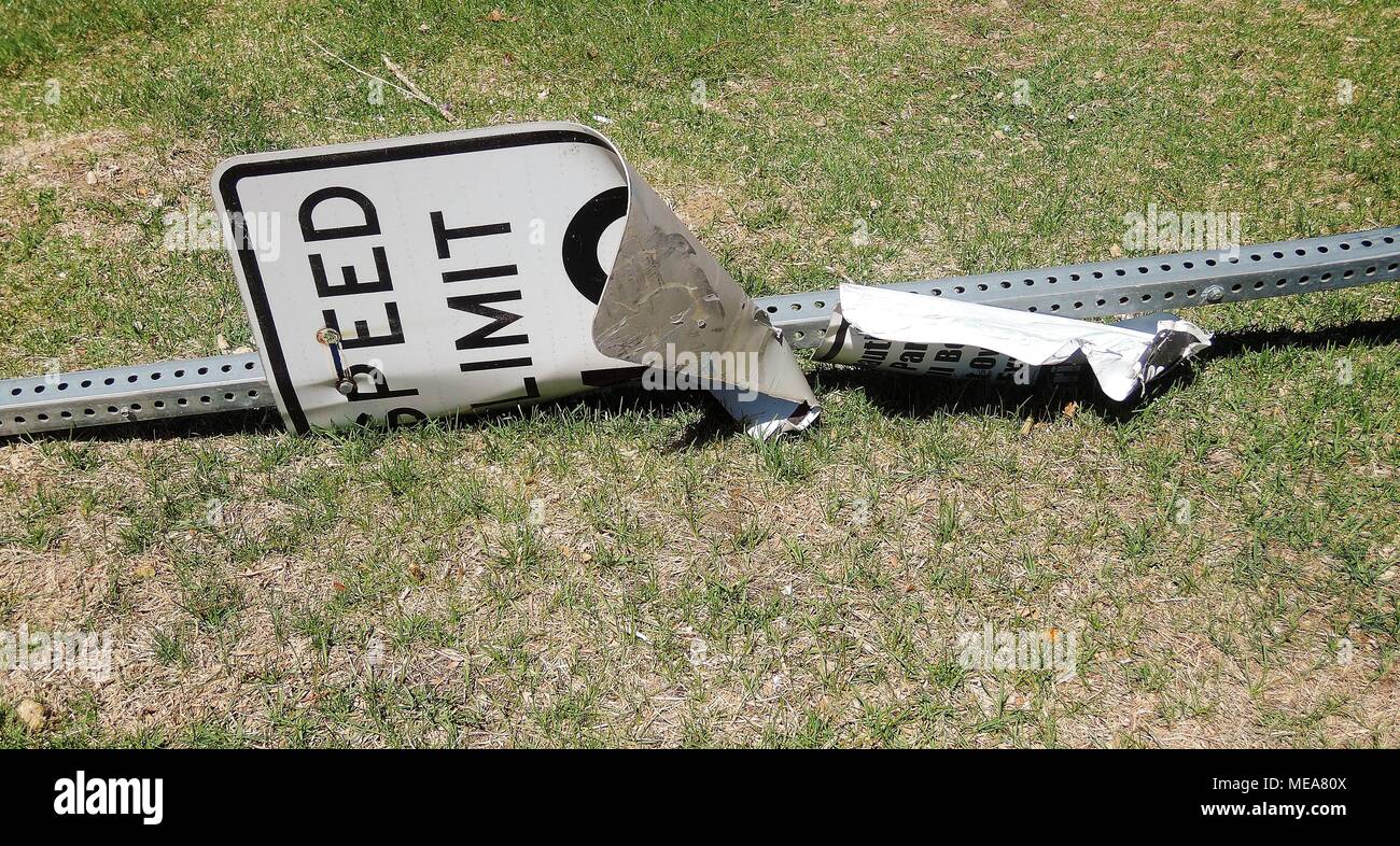 Speed Limit Sign Knocked over by Speeding Car Stock Photo