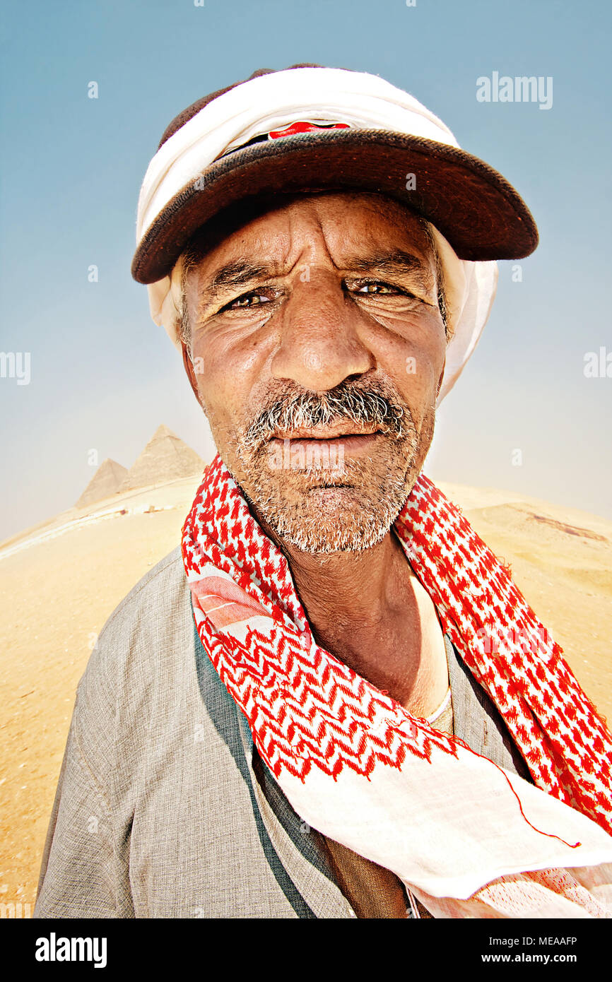 cute mustachioed Bedouin wearing a black cap and a red arafatka Stock ...