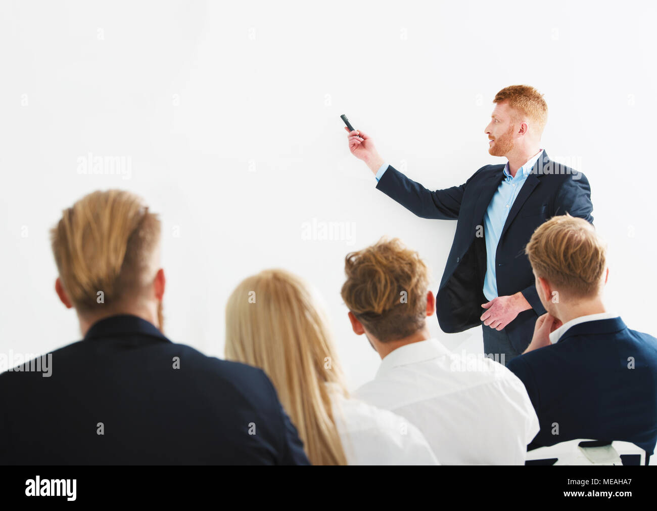 Businessman in office explain something at a training meeting Stock Photo