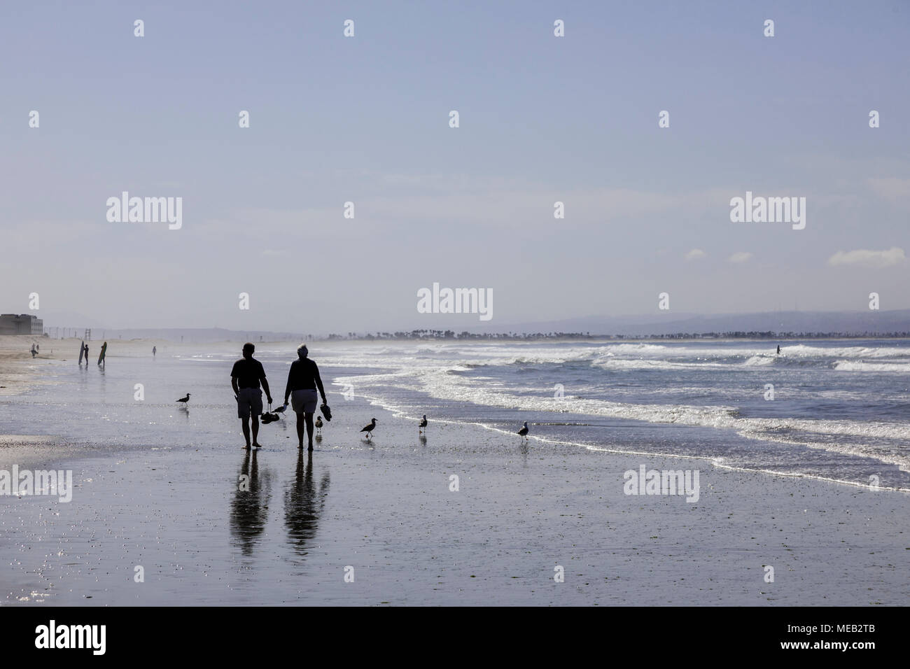 Walking barefoot along beach hi-res stock photography and images - Alamy