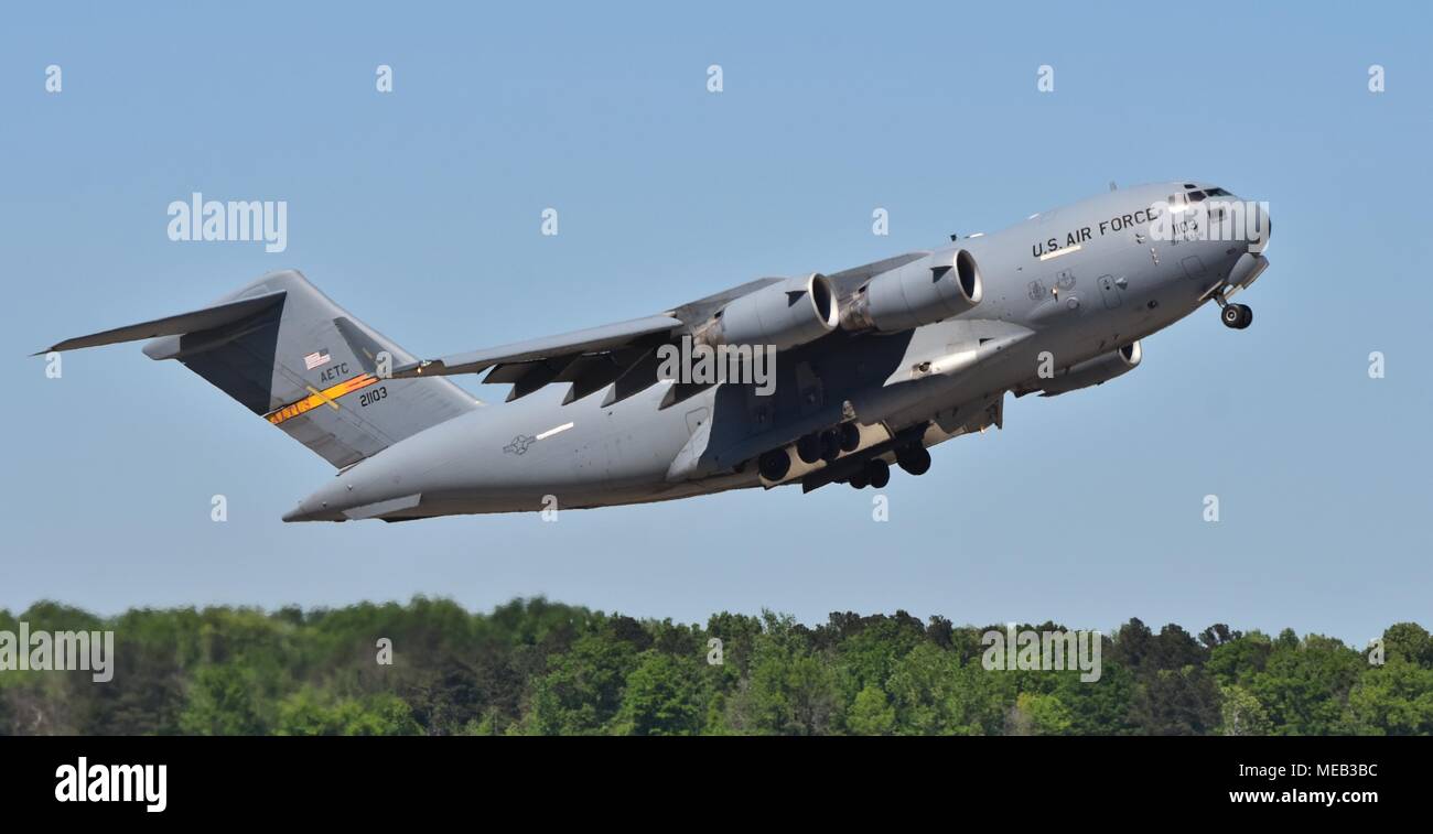 A U.S. Air Force C-17 Globemaster III cargo plane flying a sortie. This C-17 belongs to the 97th Air Mobility Wing from Altus Air Force Base. Stock Photo