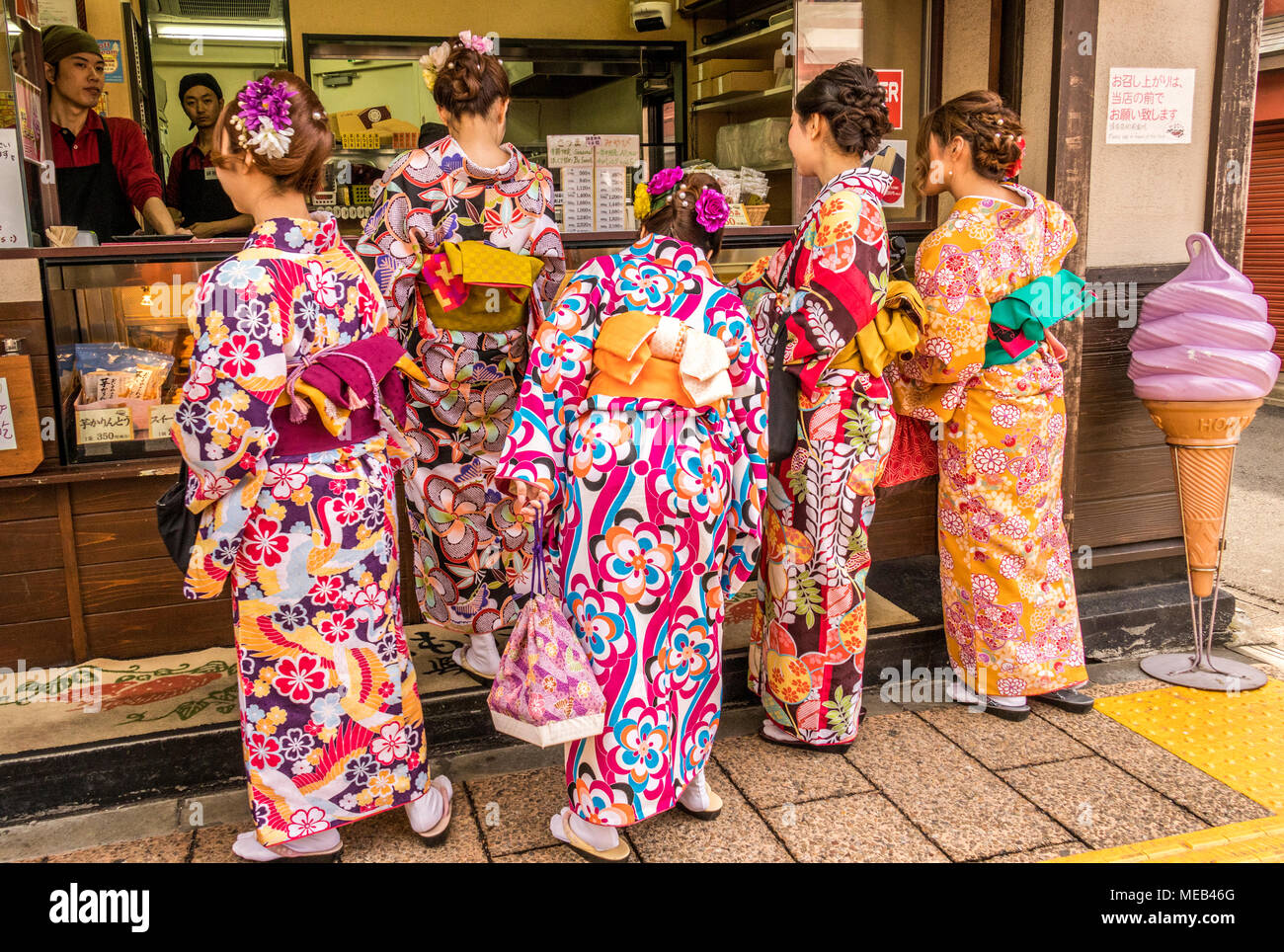 Ladies and men wearing iconic Japanese Kimono around the area of the  Asakusa Kannon Temple a Buddhist temple in Tokyo Japan Stock Photo - Alamy