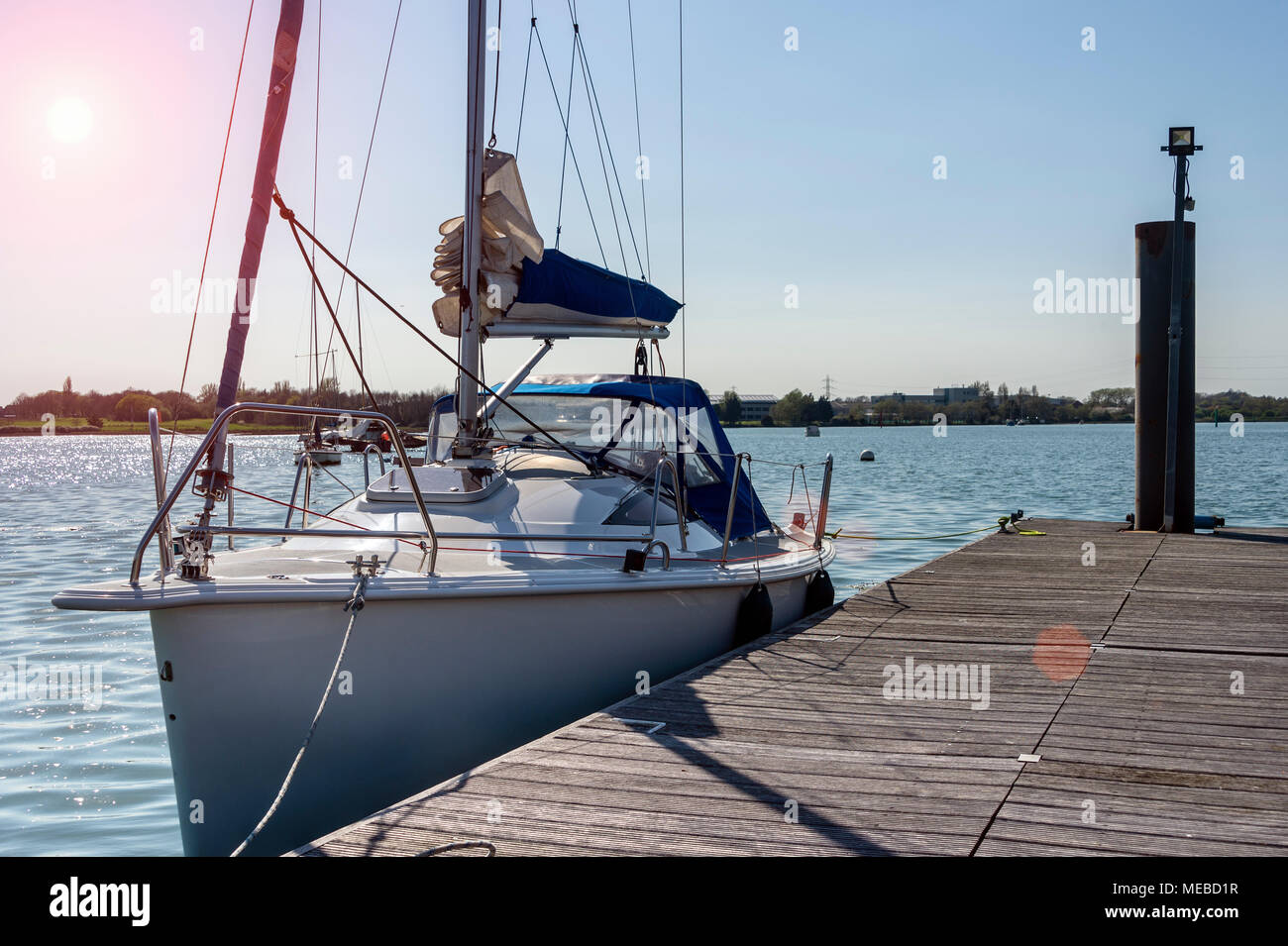 modern sailing yacht moored on a private pontoon in Portsmouth Harbour Stock Photo