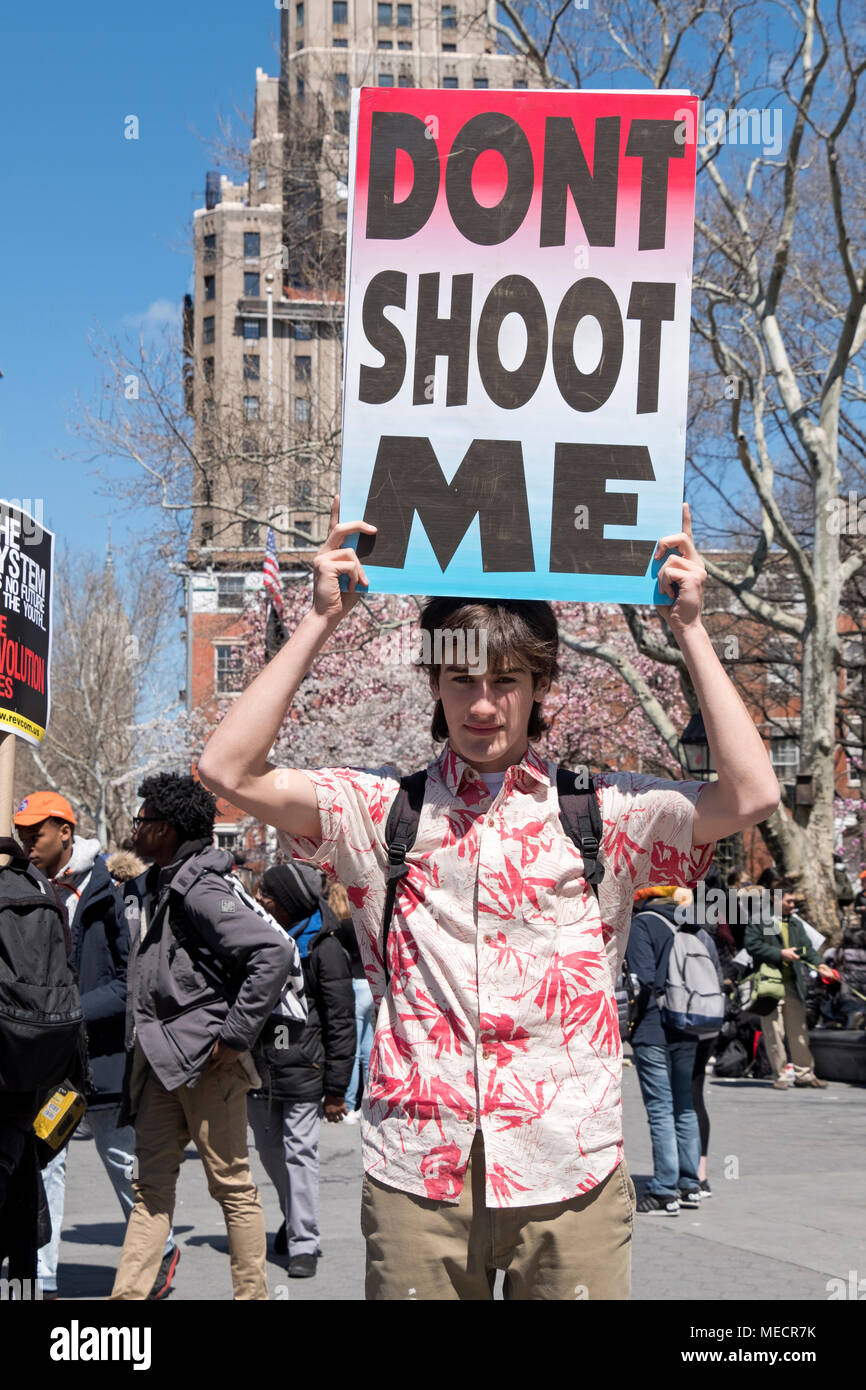 A young man holding a DON'T SHOOT ME sign at the National Schools Walkout rally in Washington Square Park in New York City. Stock Photo