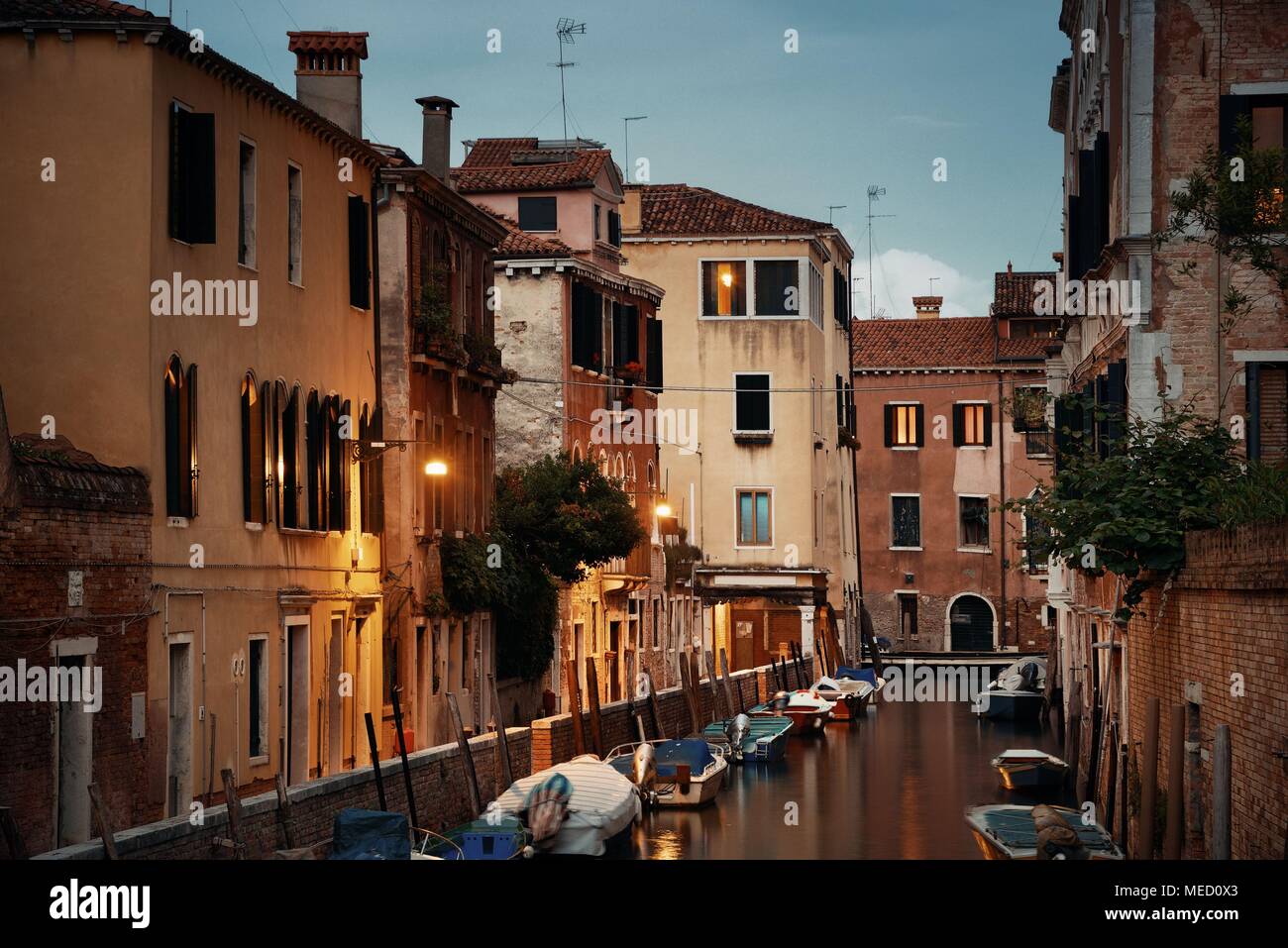 Venice canal view at night with historical buildings. Italy Stock Photo ...