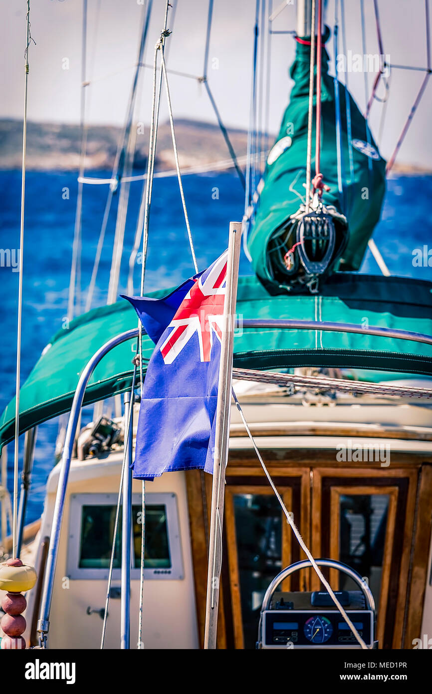 Maritime UK Flag. Close up the UK blue ensign british maritime flag flapping in the wind  on  a yacht sail boat Stock Photo