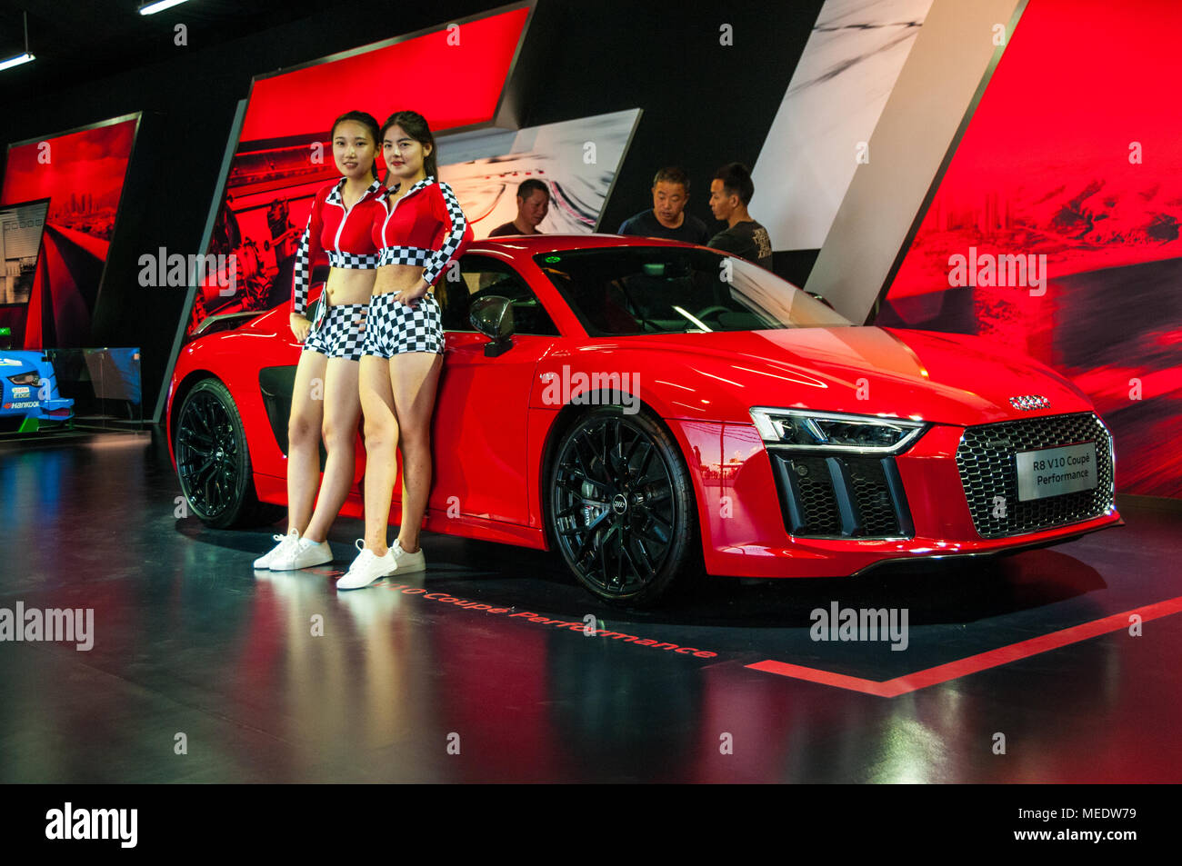 Chinese models in front of a red Audi R8 V10 Coupe Performance car at an Audi  Sport event at the Shanghai International Circuit Stock Photo - Alamy