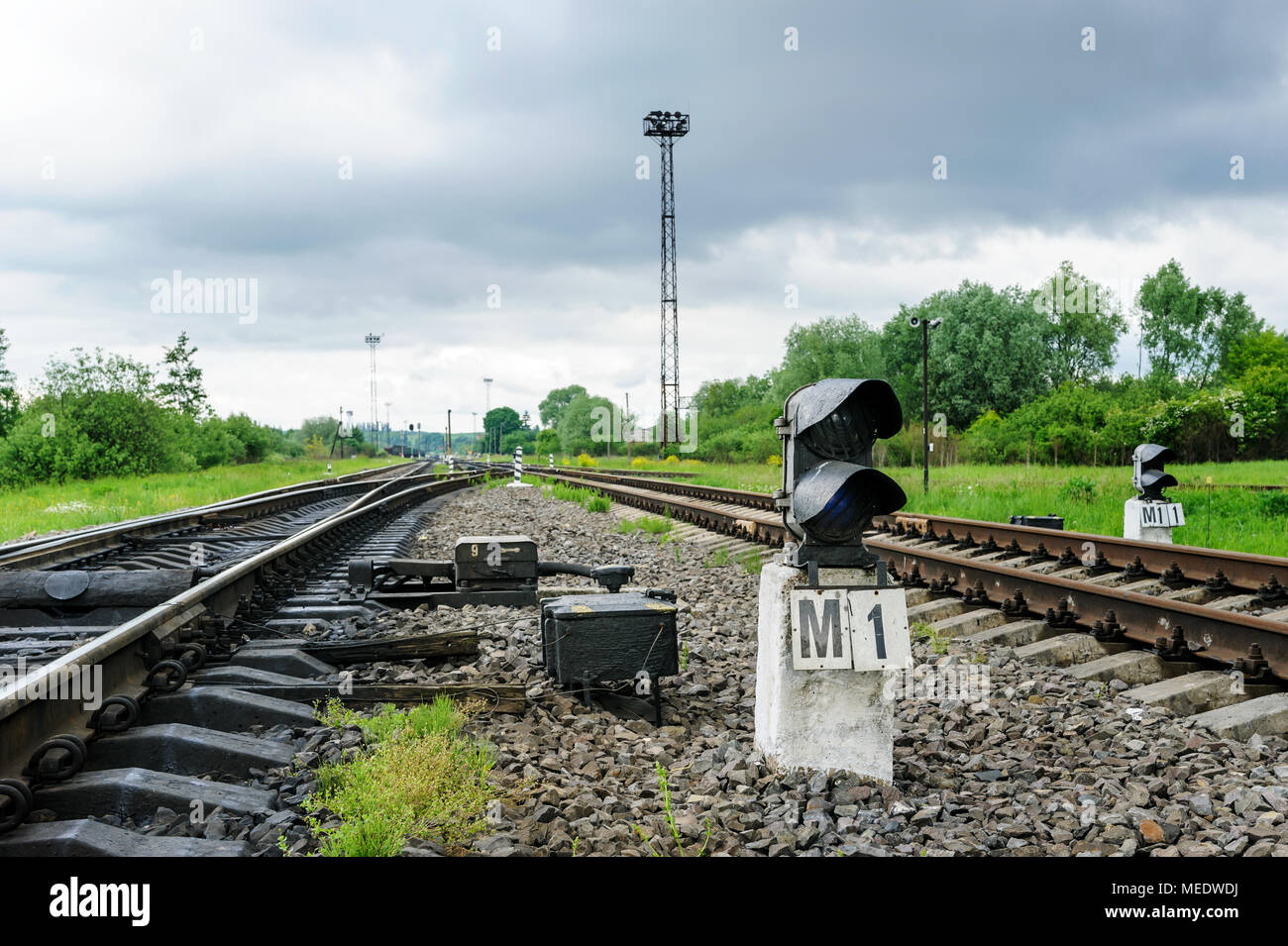 Railroad track into the distance. Semaphore is between tracks Stock Photo Alamy