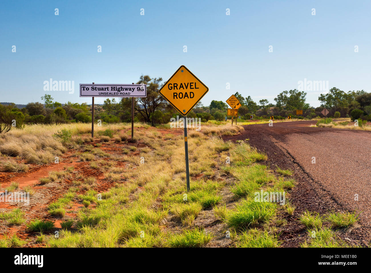 Road signs at start of unsealed outback road, Northern Territory. Stock Photo