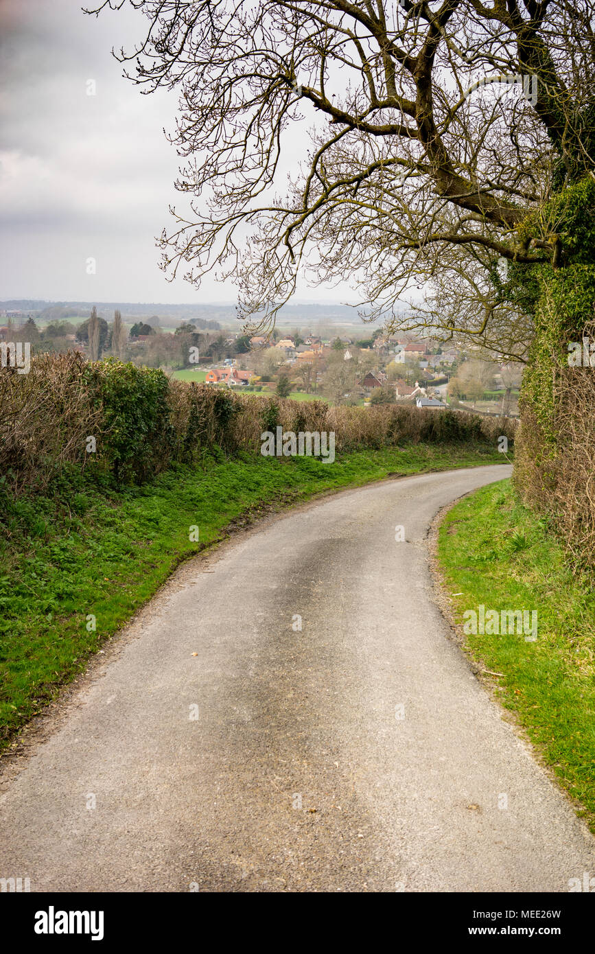 Narrow traditional country lane in West Sussex England overlooking Pulborough water meadows Stock Photo