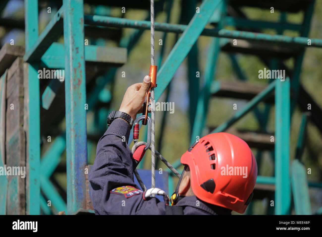 BUCHAREST, ROMANIA - APRIL 21: Firefighters are rappelling and climbing ropes at a drill exercise, on April 21, 2017, in Bucharest Stock Photo