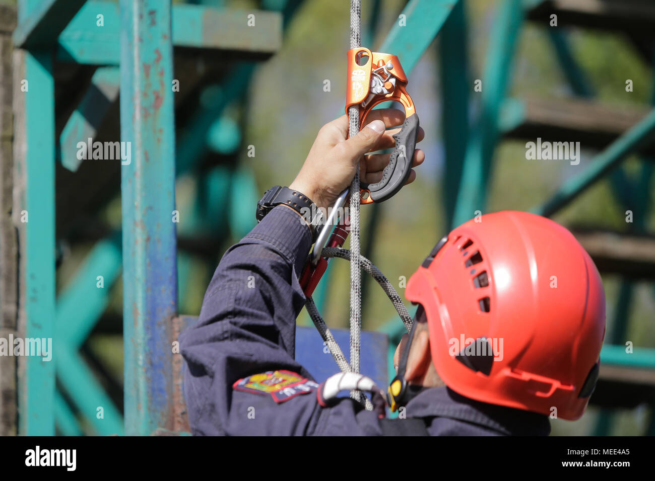 BUCHAREST, ROMANIA - APRIL 21: Firefighters are rappelling and climbing ropes at a drill exercise, on April 21, 2017, in Bucharest Stock Photo