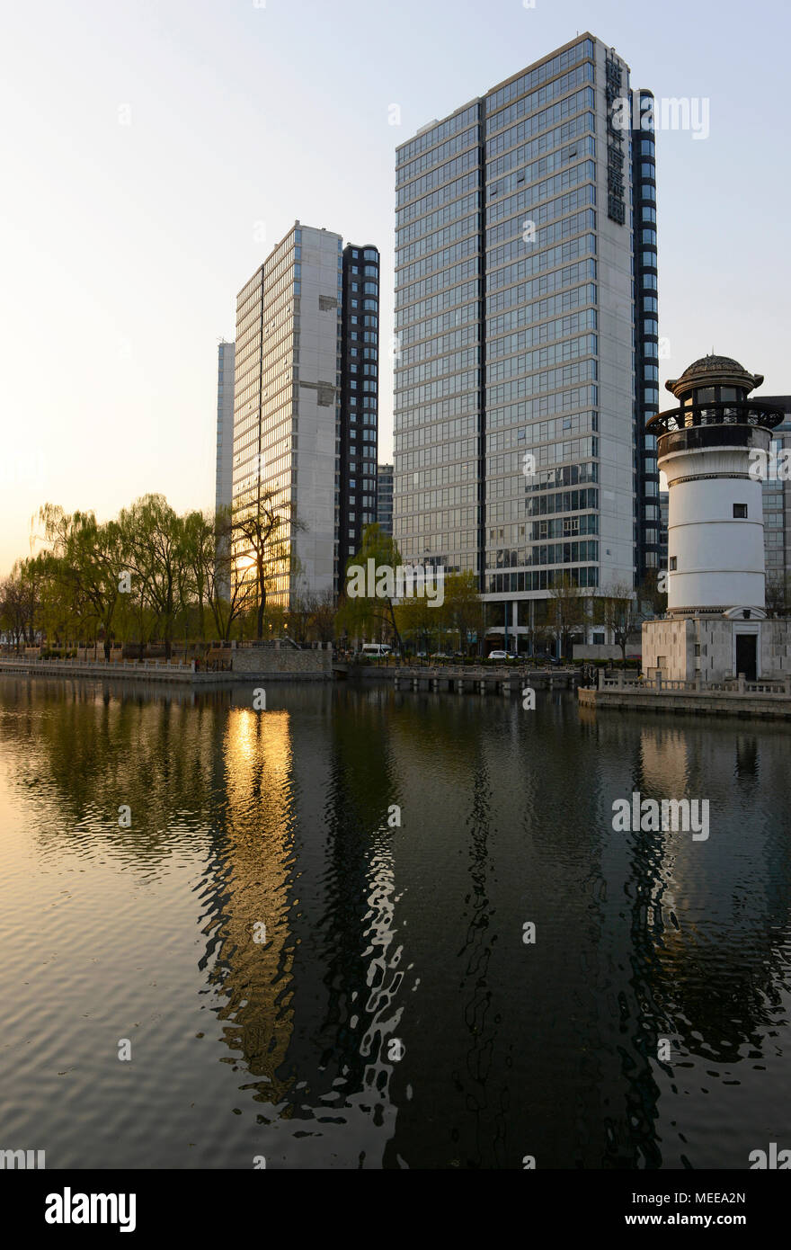 Residential buildings and a lighthouse by the Yongdinghe channelised ...