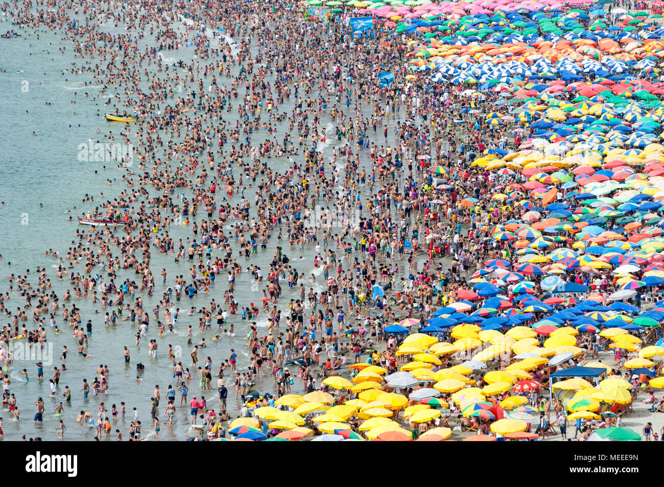Overcrowded beach in Lima, Peru Stock Photo