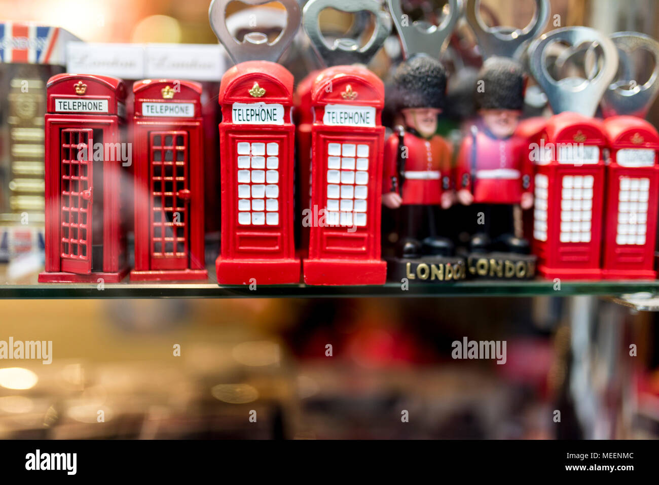 A London souvenir shop displaying British souvenirs including classic British red telephone boxes and beefeater and London Tower Guards bottle openers Stock Photo