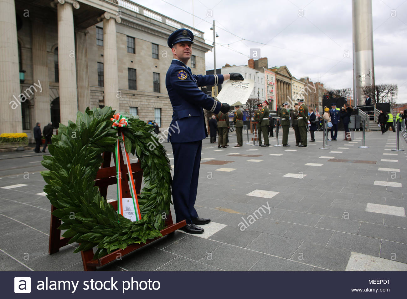 Captain Sean McCarthy holds a copy of the 1916 Proclamation of the Irish Republic aloft outside the GPO in Dublin. Credit reallifephotos/Alamy Stock Photo