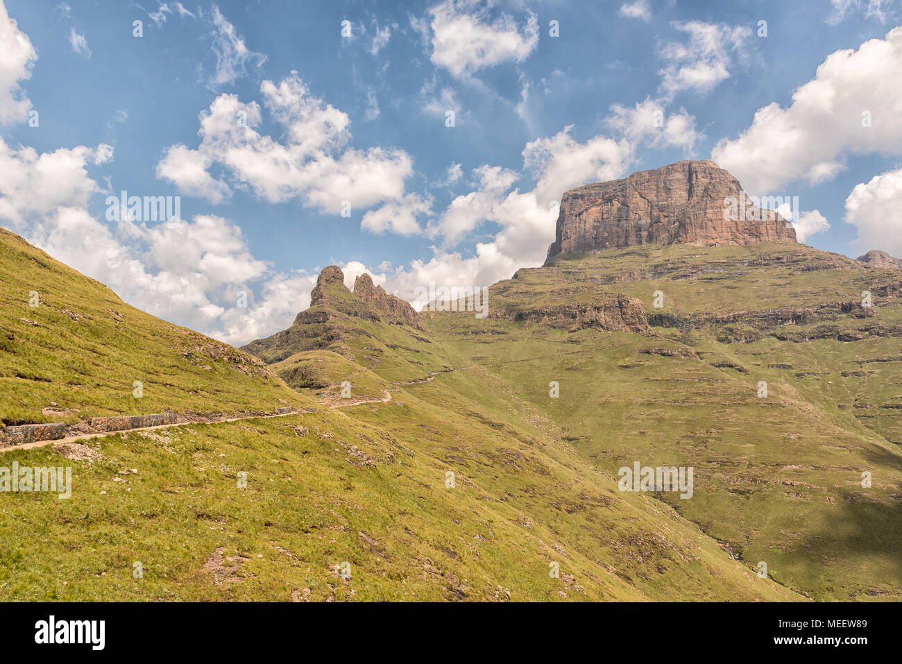 The Sentinel Trail to the Tugela Falls in the Drakensberg climbs past the Three Witches and then zig-zags up the slopes of the Sentinel Stock Photo