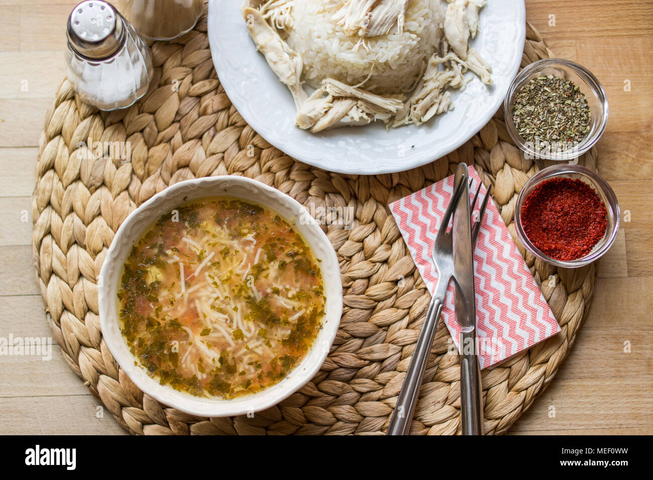 Traditional Turkish chicken broth soup with chicken on a rice pilaf (tavuklu pilav Stock Photo