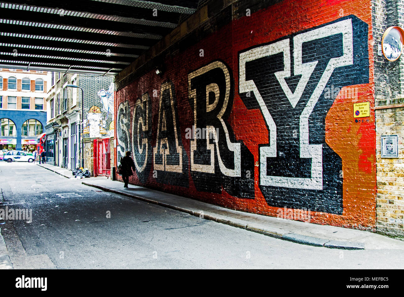 Walking under a SCARY bridge in London. Street Scene and Street Art Stock Photo