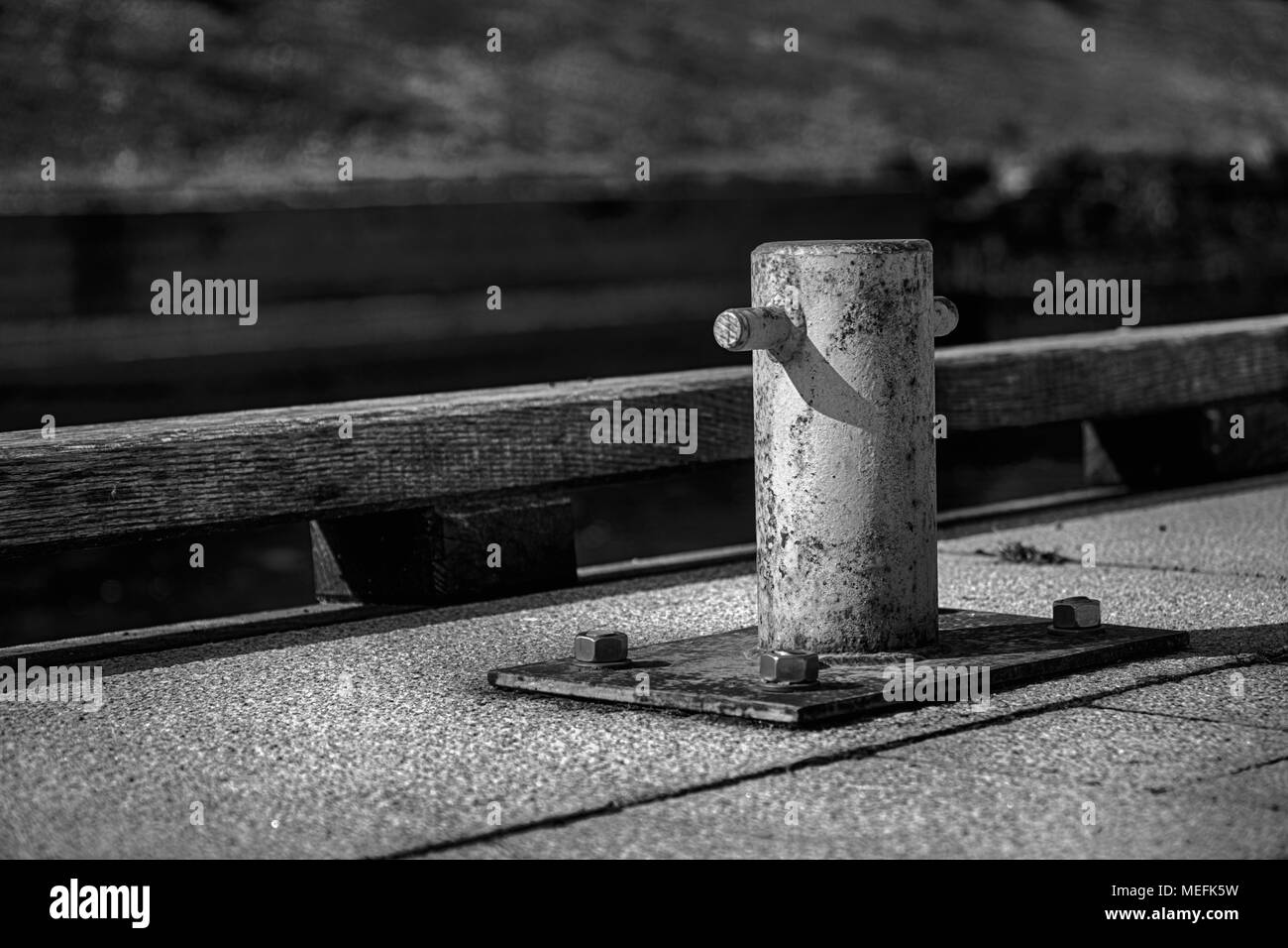 Mooring bollard for river boat, steel post for moorings. Stock Photo