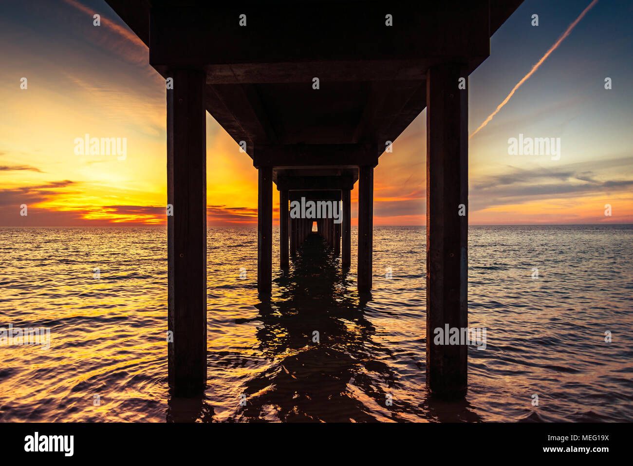 Dramatic sunset view from under Brighton Jetty, South Australia Stock Photo