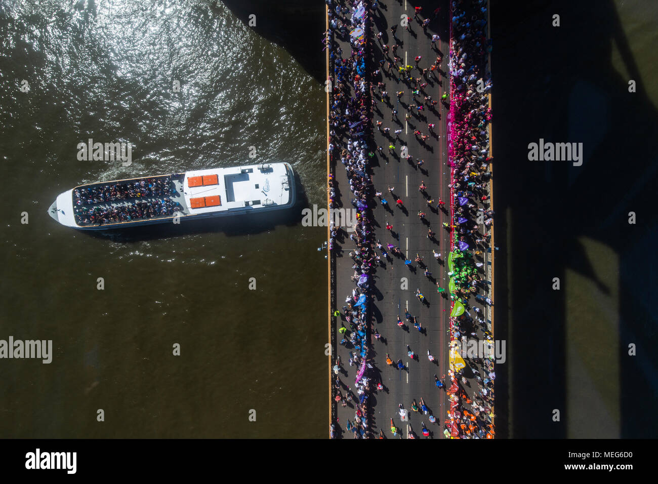 Runners make their way over Tower Bridge during the 2018 Virgin Money London Marathon. Stock Photo