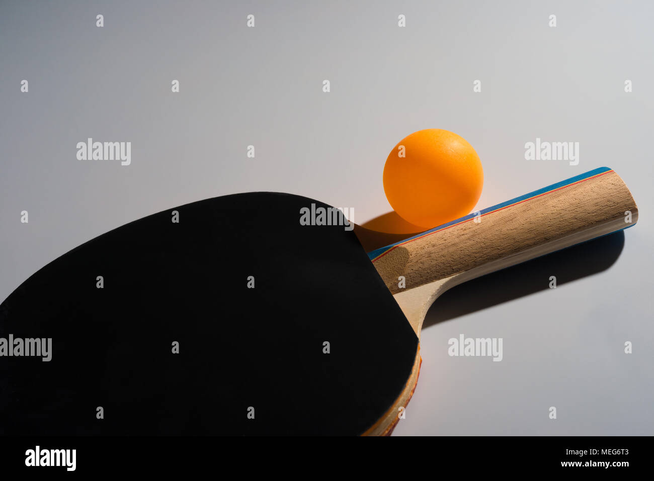 pingpong rackets and ball on a grey background Stock Photo