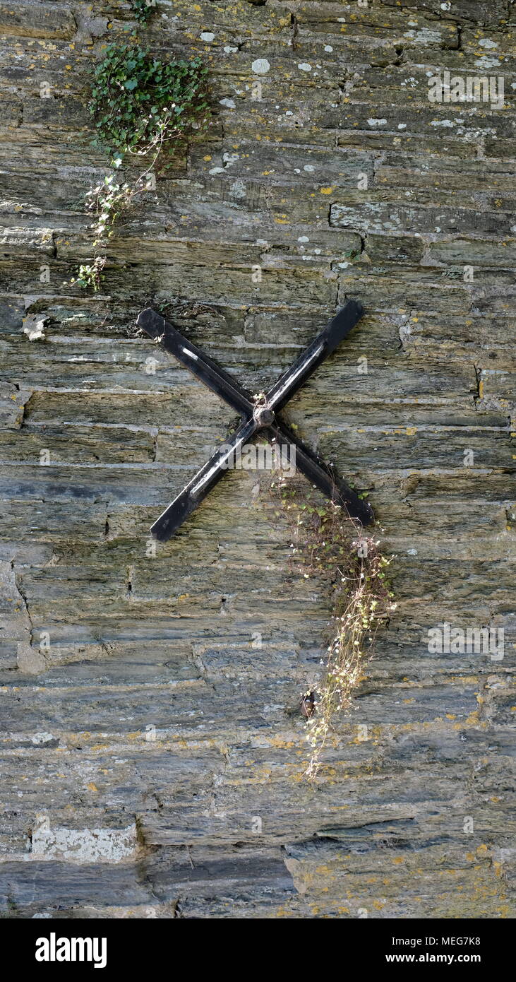 Black cross shaped anchor plate. Stock Photo