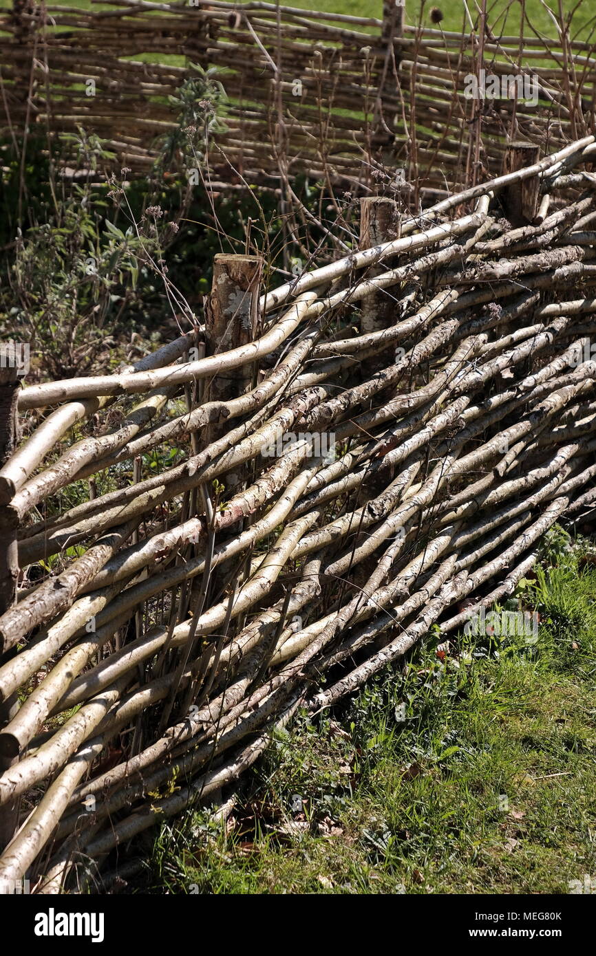 A great example of a weaved fence at the Weald and Downland working museum near Chichester, UK Stock Photo