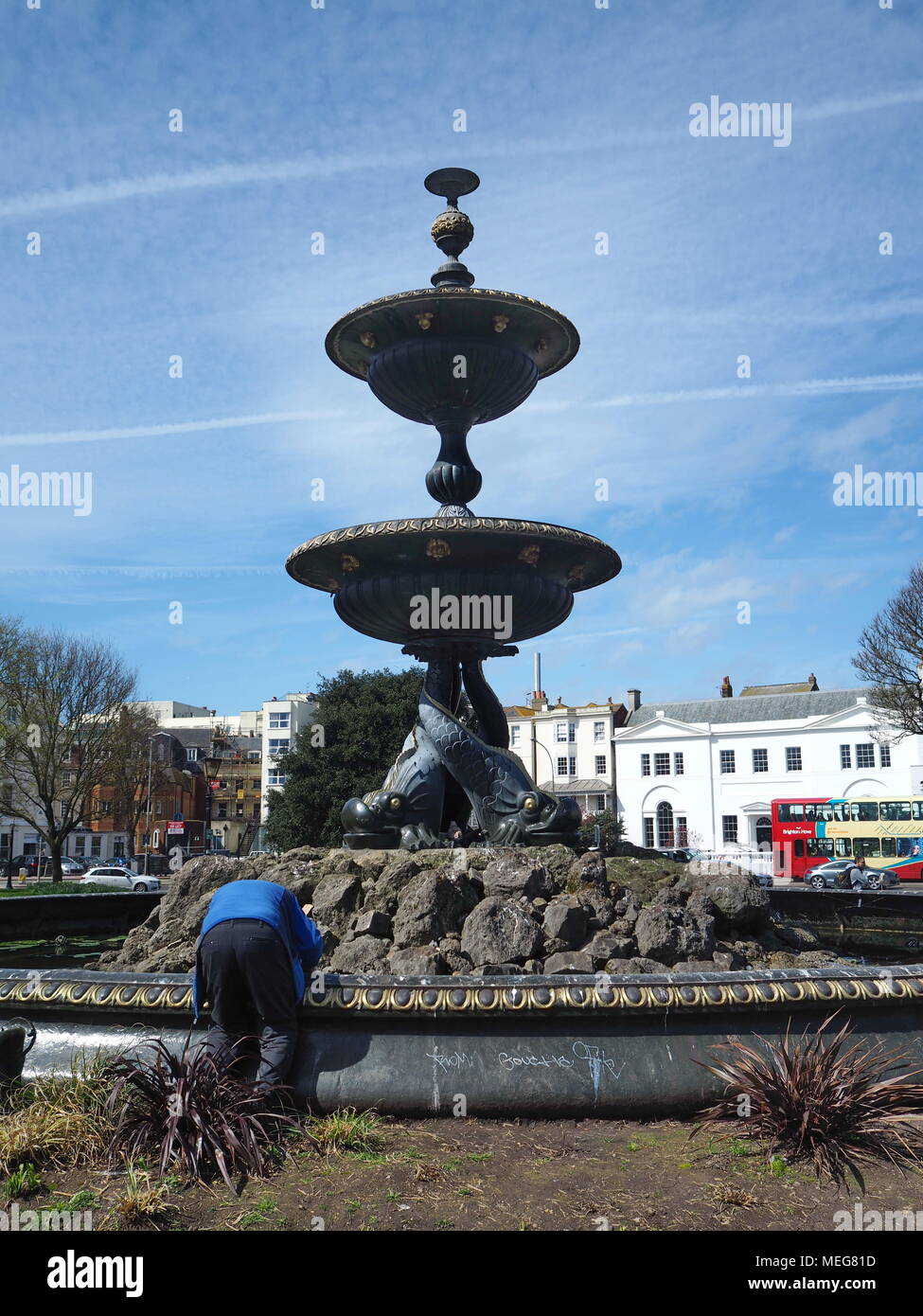 A technician working on the Victoria fountain at the old Steine gardens in Brighton, UK Stock Photo