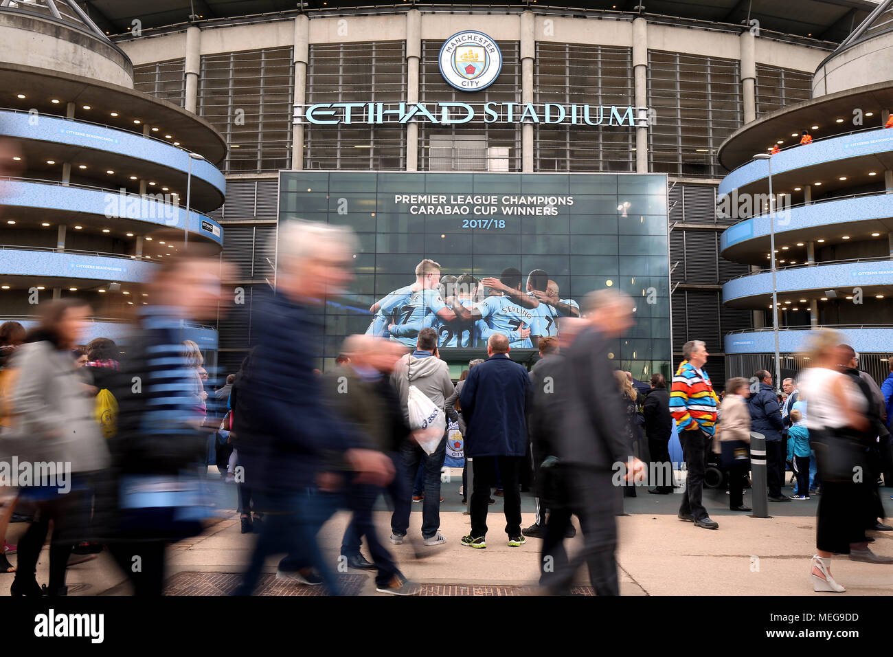 Manchester City Fans Outside The Ground In Front Of Writing Listing Them As Carabao Cup And Premier League Champions Before The Premier League Match At The Etihad Stadium Manchester Stock Photo
