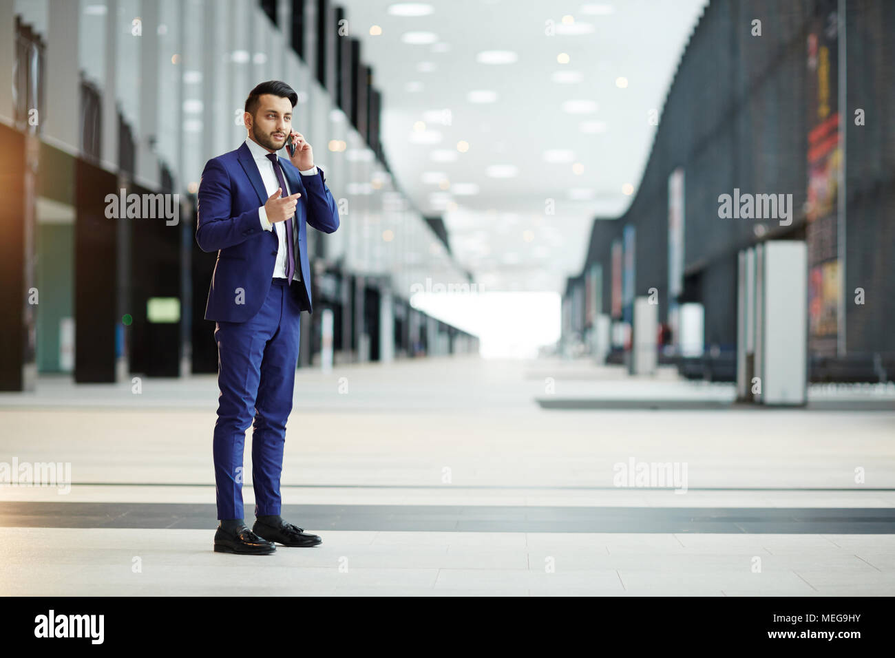 Calling in airport lounge Stock Photo