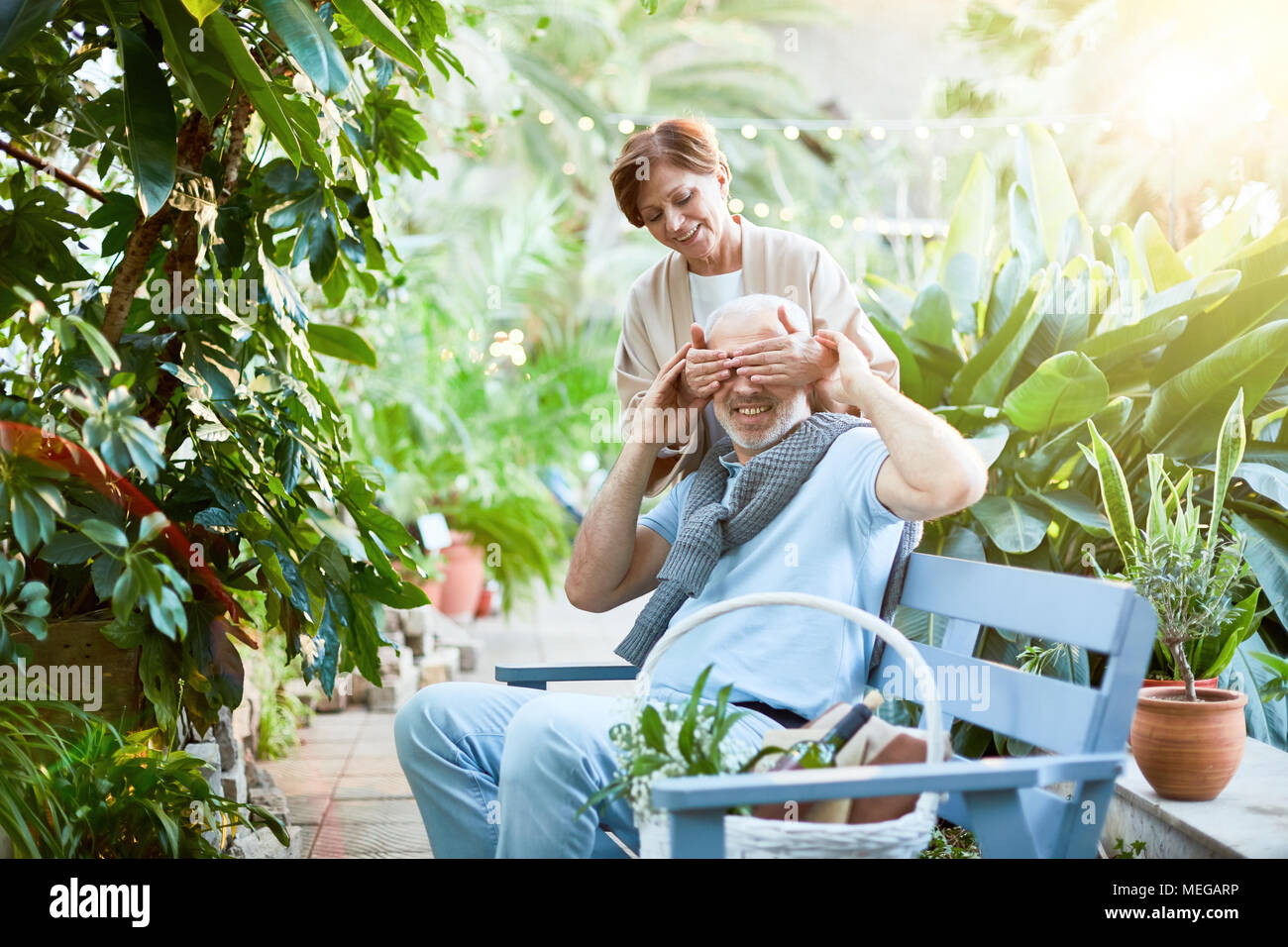 Mature woman relaxing in garden hi-res stock photography and images - Alamy