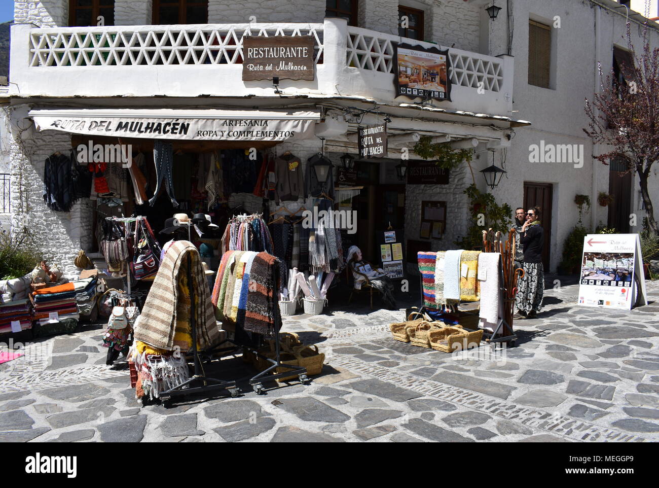 Craft shop at the entrance of the mountain village of Pamapneira, Las  Alpujarras, Province of Granada, Spain Stock Photo - Alamy
