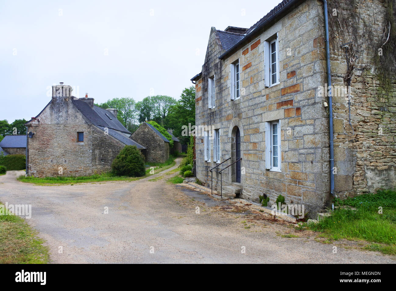 A group of farm buildings, Berrien, Brittany, France - John Gollop Stock Photo