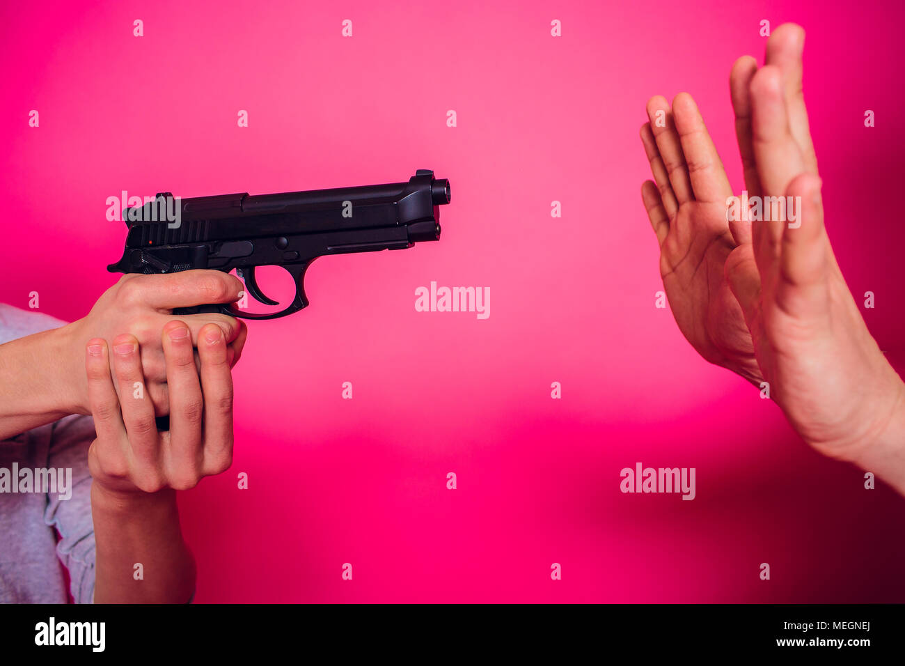 Armed campus gun allowed in some US universities concept the weapon in hands against the teacher Stock Photo