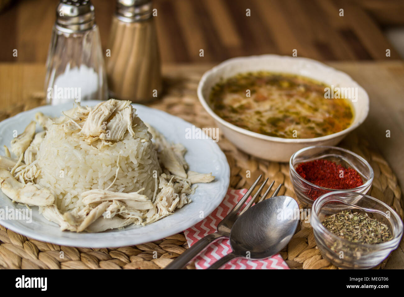 Turkish traditional chicken on a rice pilaf (tavuklu pilav) and chicken broth soup Stock Photo