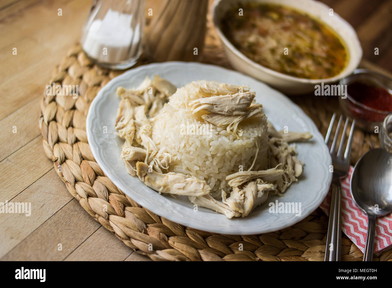 Turkish traditional chicken on a rice pilaf (tavuklu pilav) and chicken broth soup Stock Photo