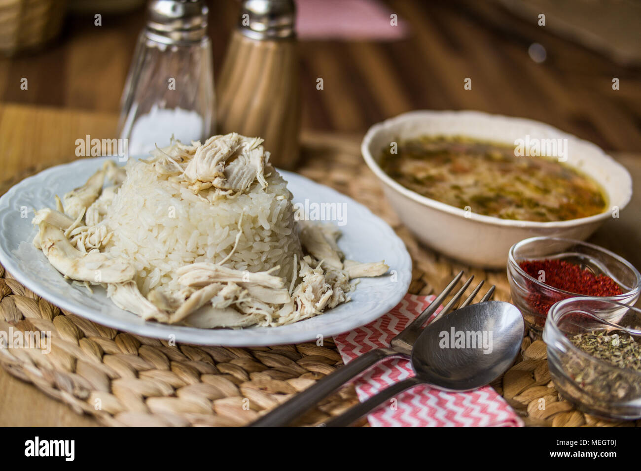 Turkish traditional chicken on a rice pilaf (tavuklu pilav) and chicken broth soup Stock Photo