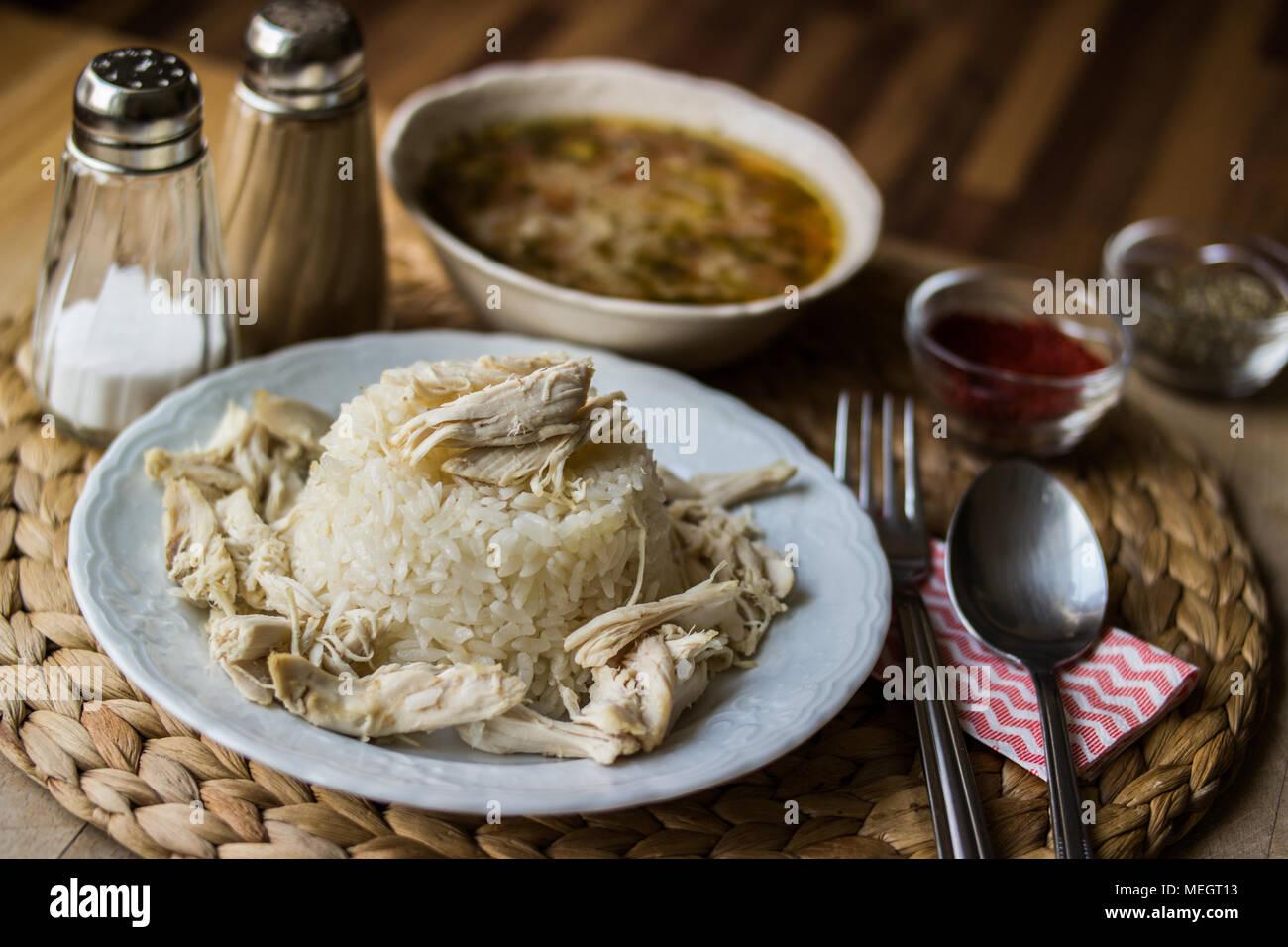 Turkish traditional chicken on a rice pilaf (tavuklu pilav) and chicken broth soup Stock Photo
