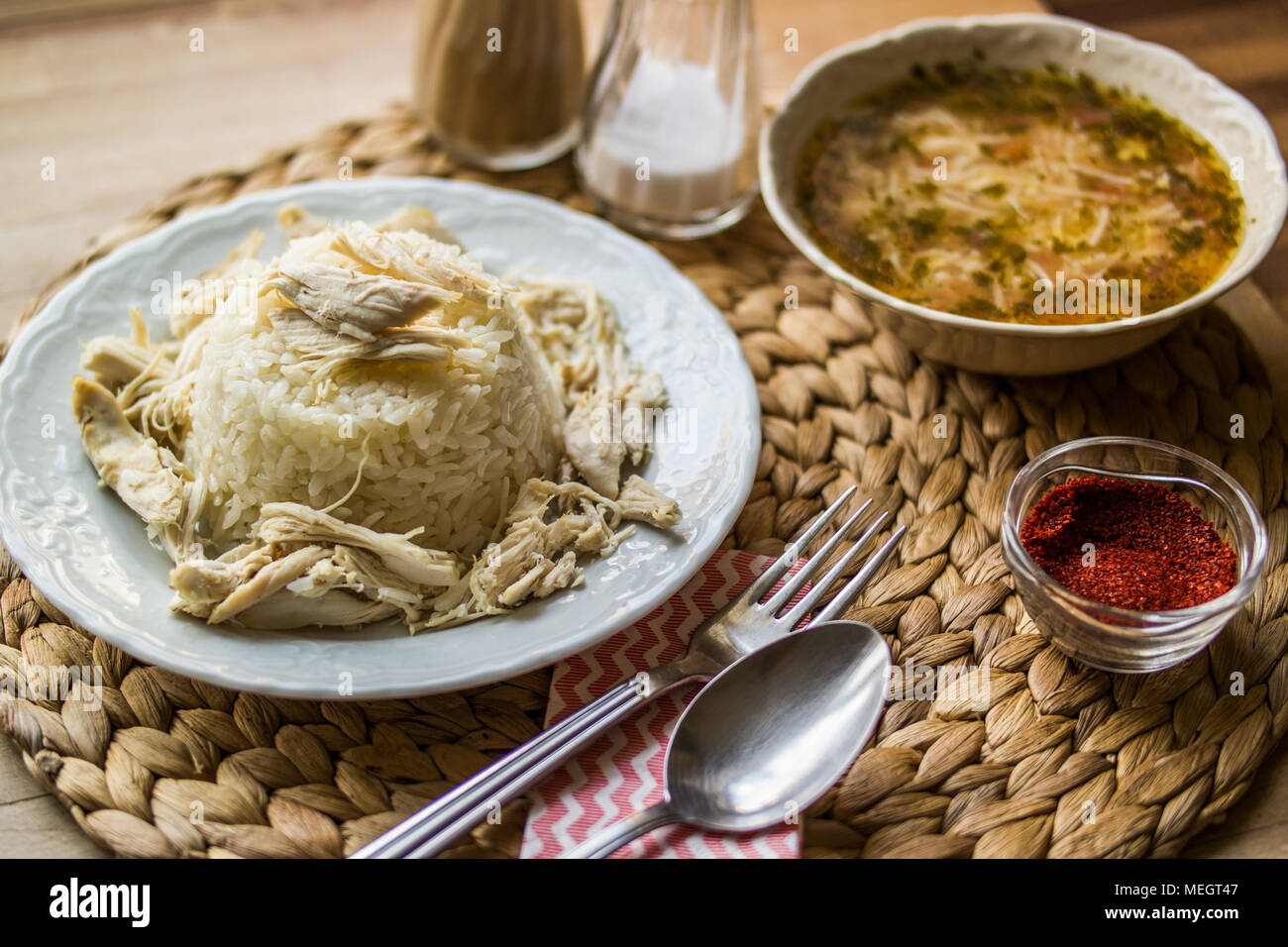 Turkish traditional chicken on a rice pilaf (tavuklu pilav) and chicken broth soup Stock Photo