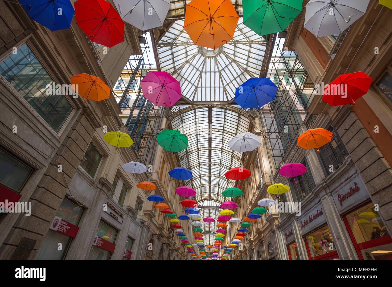 GENOA, ITALY, APRIL 16, 2018 - Multicolored umbrellas in the sky above Galleria Mazzini in the center of Genoa, Italy. Stock Photo
