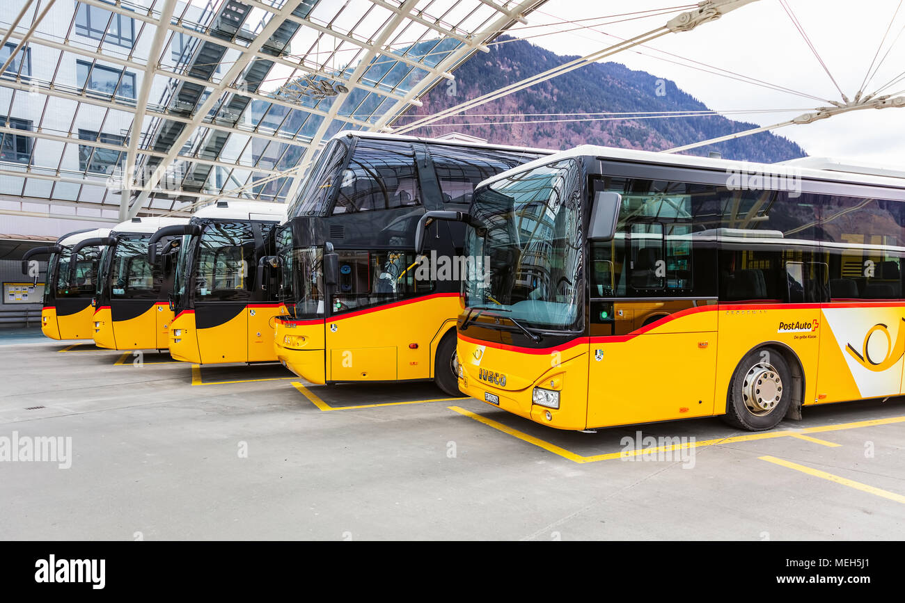 Chur, Switzerland - 3 March, 2017: Post Buses at the Chur bus station. Post Bus Switzerland (German: PostAuto Schweiz) is a subsidiary company of the Stock Photo