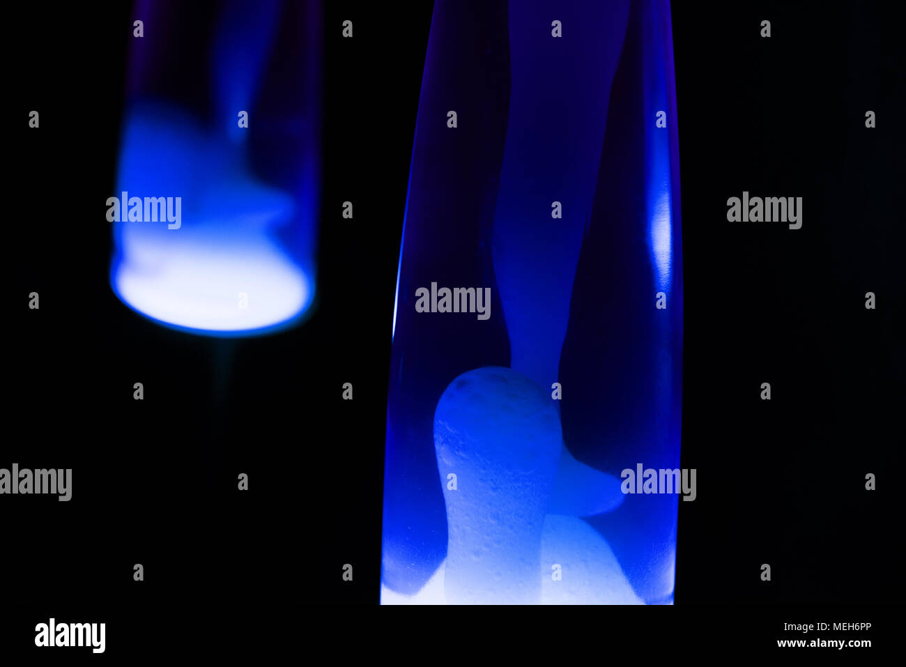 Lava lamp reflection. Abstract isolated composition on black background
