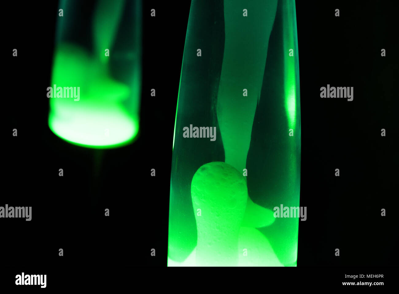 Lava lamp reflection. Abstract isolated composition on black background Stock Photo