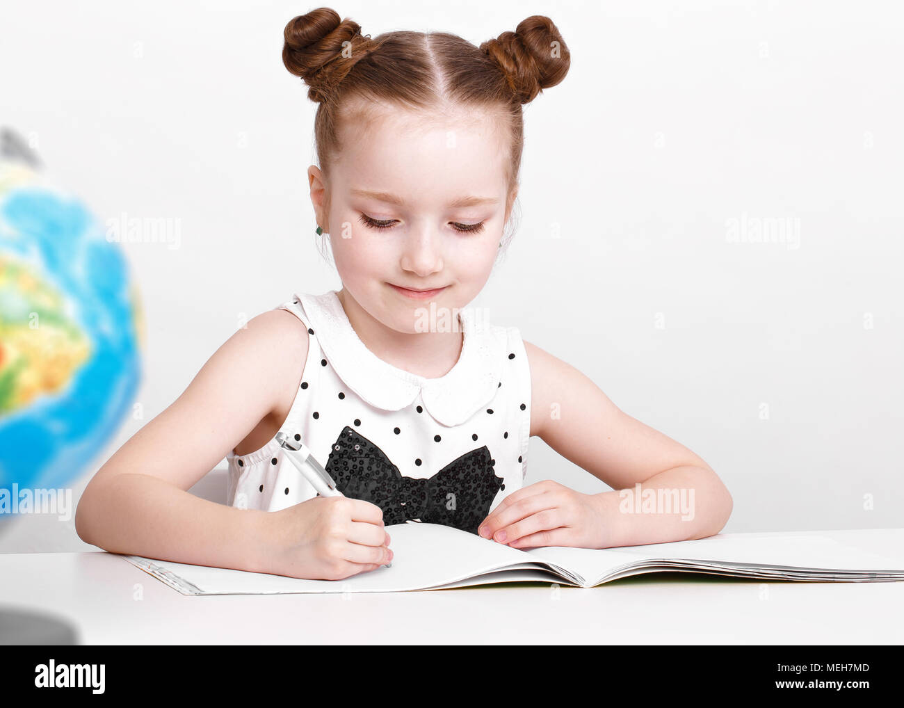 funny-little-girl-at-the-table-of-a-first-grader-stock-photo-alamy